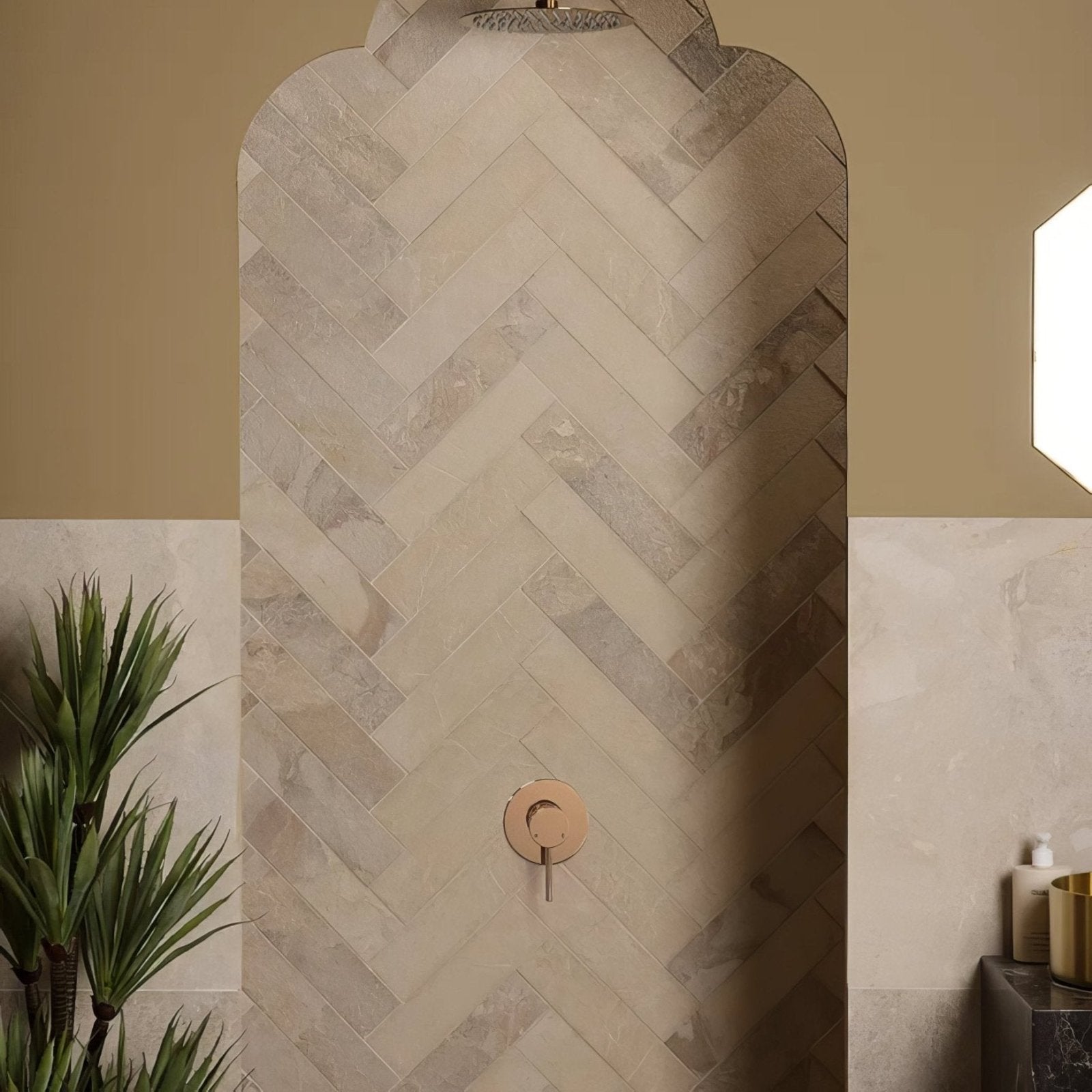 Beige herringbone patterned enki limestone parquet stone tiles with velvet finish and subtle natural veining