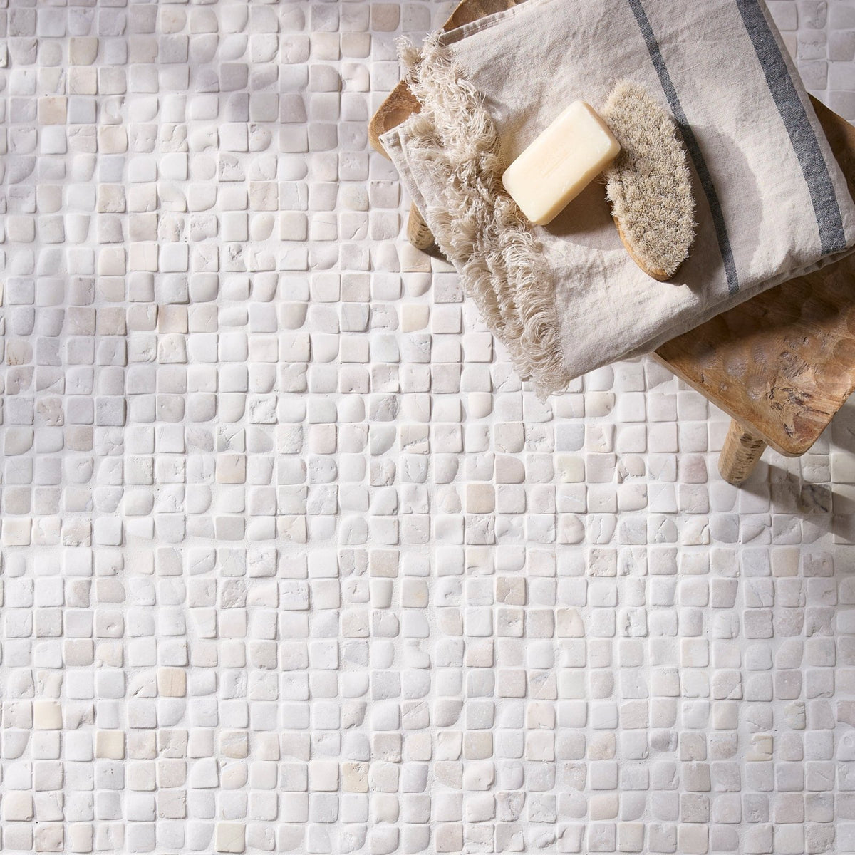 White mosaic tile floor with subtle textured surface in enso cobble mosaic cube chalk style