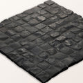 Enso cobble mosaic cube charcoal black textured stone tile with rustic uneven surface and interlocking square pieces