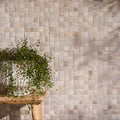 Beige and gray Enso Cobble Mosaic Cube Sand tile wall with subtle textured finish for decorative surfaces