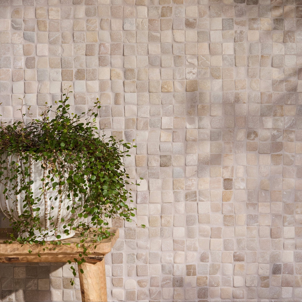 Beige and gray Enso Cobble Mosaic Cube Sand tile wall with subtle textured finish for decorative surfaces