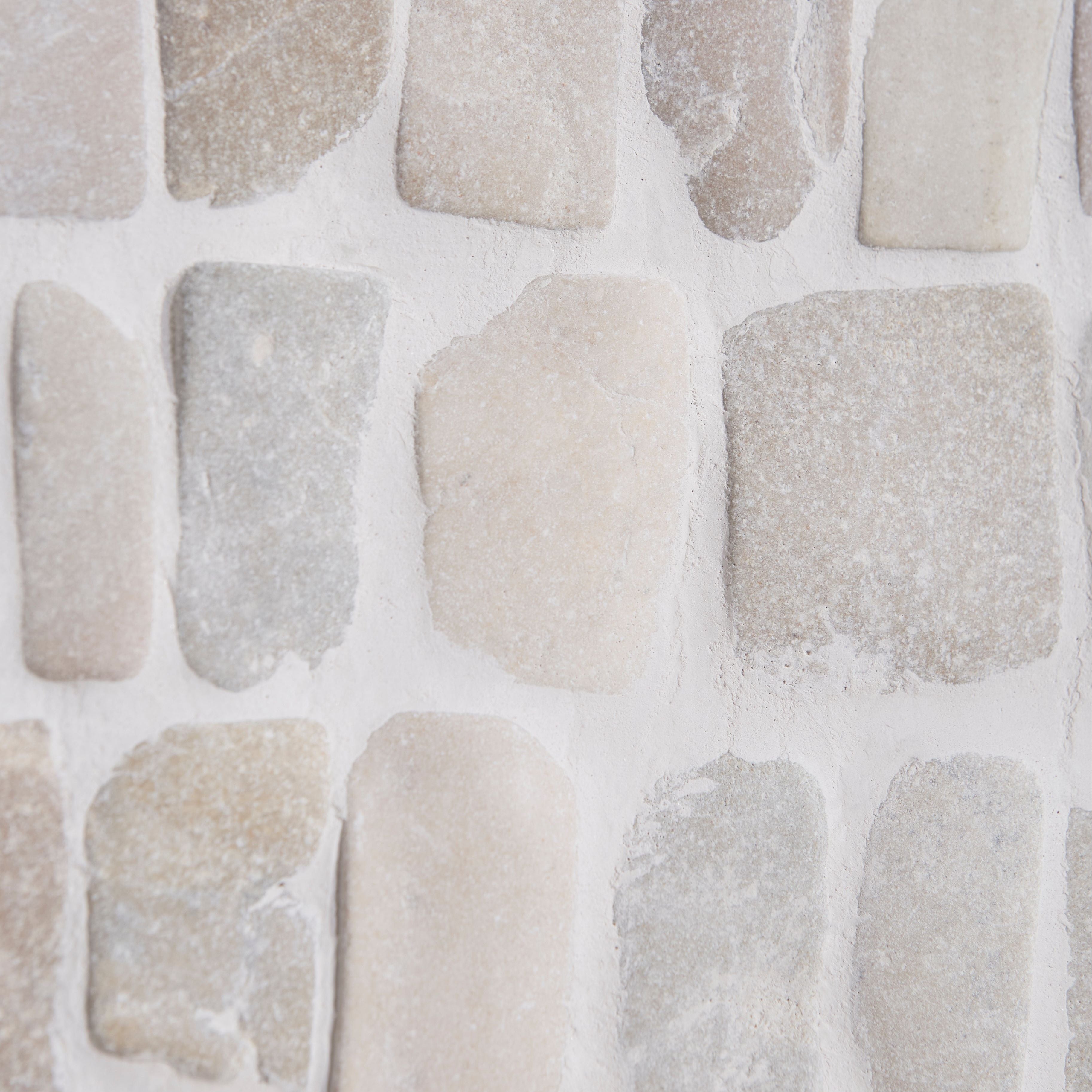 Enso cobble mosaic strip chalk featuring beige and gray rustic irregular stone veneer for wall decoration