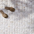 Enso Cobble Mosaic Strip Chalk, chalk-white pebble-effect stone mosaic