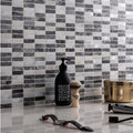 Eris Running Brick Mosaic grey and white marble brick mosaic with a black liquid soap bottle