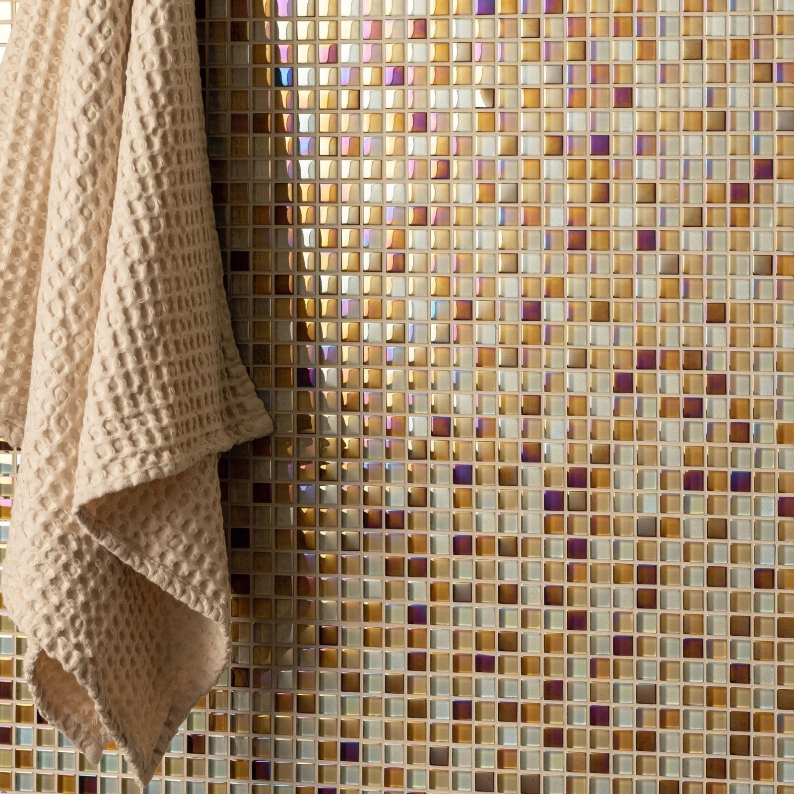 Ethereal Earth and Fire Mixed Mosaics iridescent gold and amber mosaic with a beige waffle towel