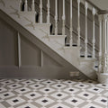 White ornate staircase with decorative balusters and newel posts in exeter chester mews and dover white finish