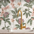 Gold-toned exotic paradise 16 tile panel with a sleek curved spout faucet featuring a modern design