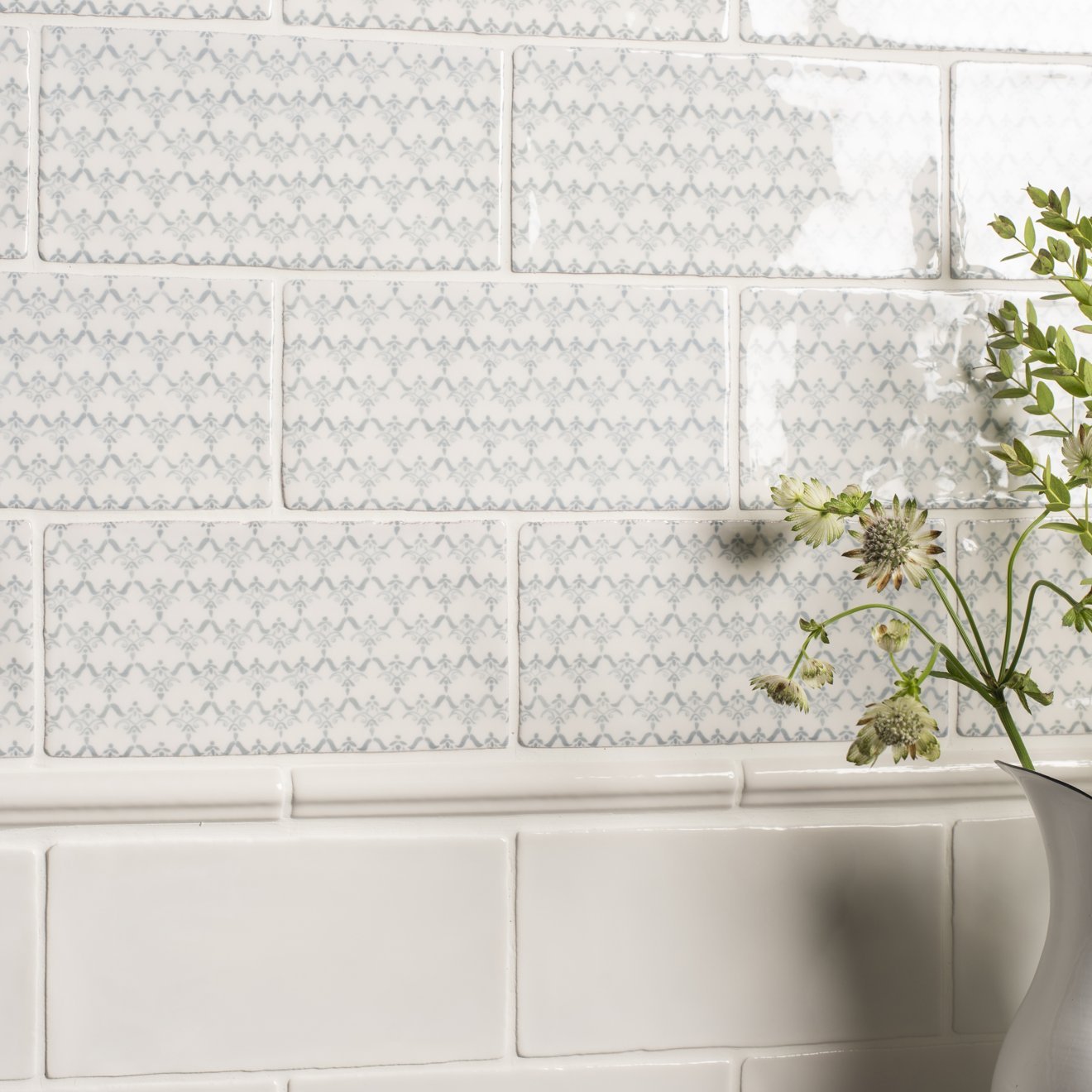 Fabrique Clara French blue white subway tiles with subtle gray geometric pattern in classic brick layout