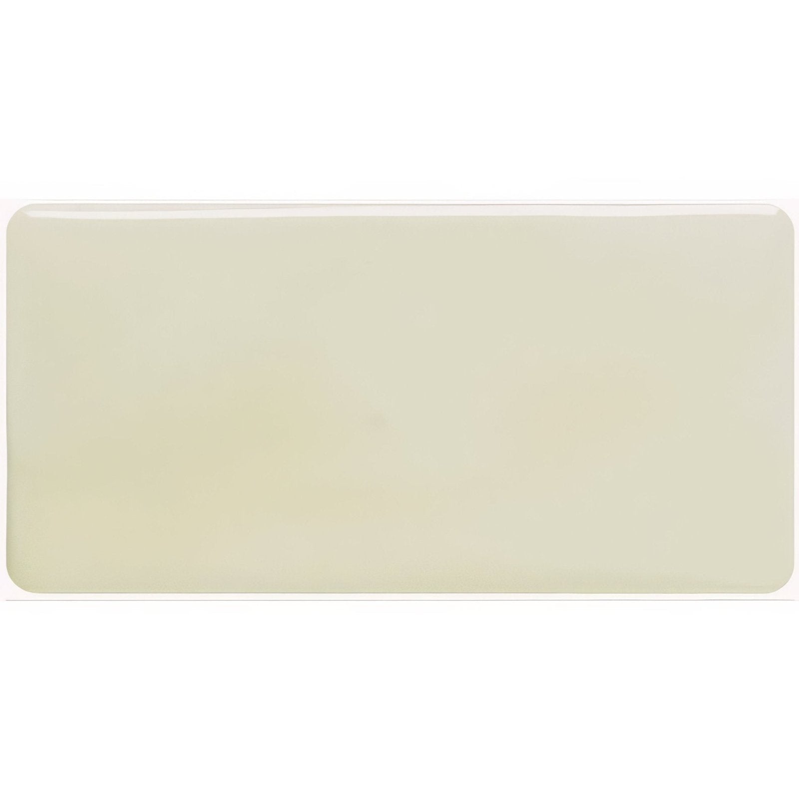 Cream-colored fennel half tile with smooth glossy surface and rounded edges for wall and backsplash use