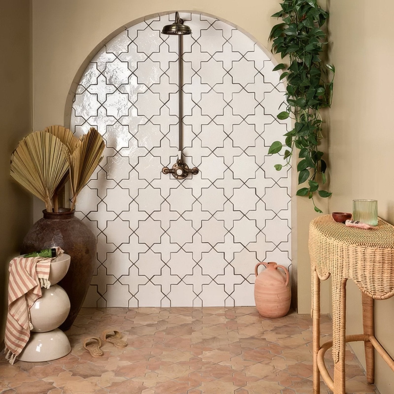 White ceramic porcelain tiles with black geometric star patterns forming an arched shower wall in fez porcelain star white