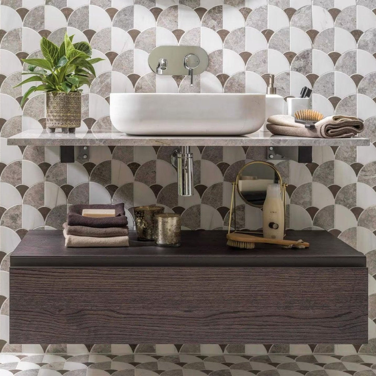 Figure Shell Dark Mosaic grey and white marble scallop mosaic behind a white vessel sink