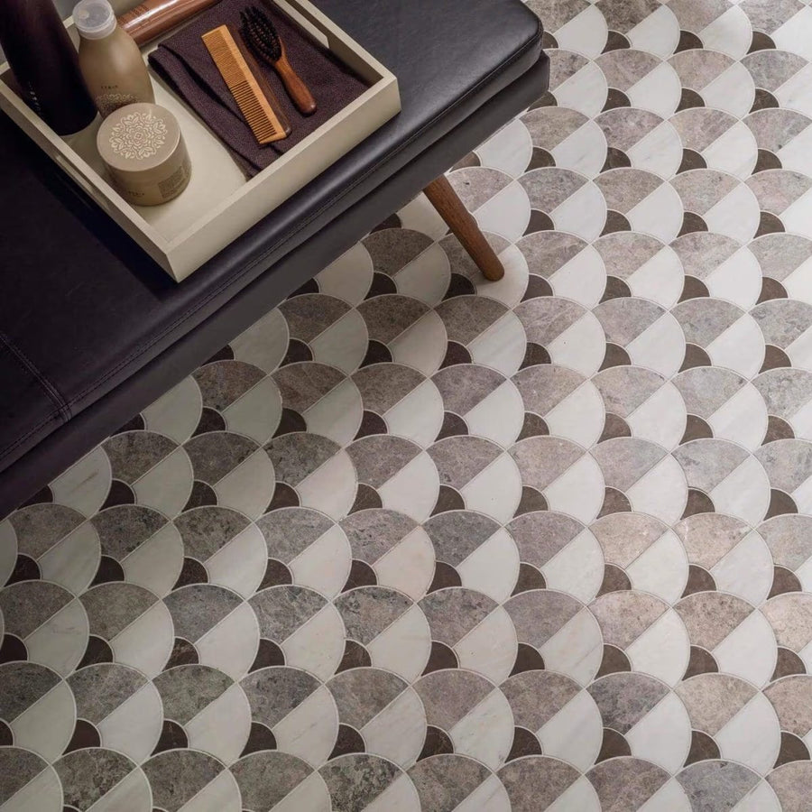 Figure shell dark mosaic gray and white marble effect tiles arranged in a repeating scallop pattern