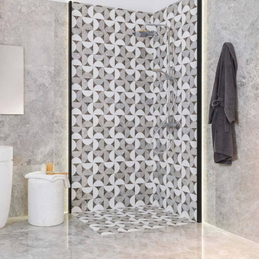 The figure spiral dark mosaic shower screen features a modern geometric pattern of gray and white circles framed in black