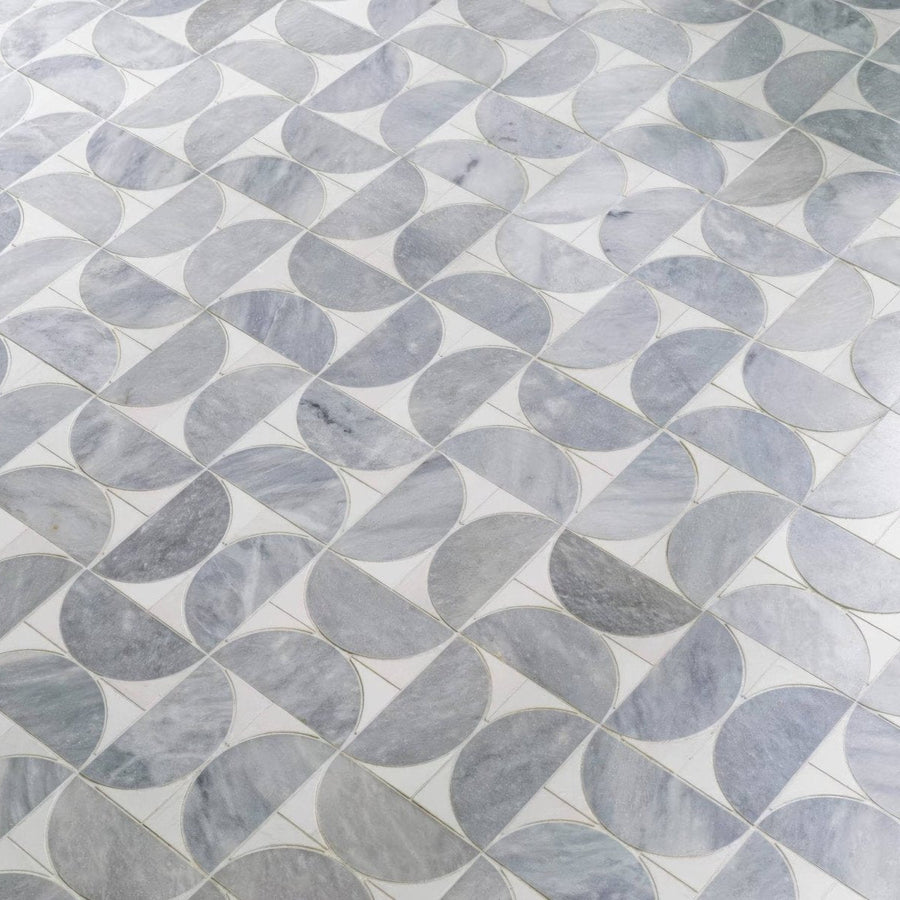 Figure spiral light mosaic gray marble tiles with swirling veining in an interlocking geometric design