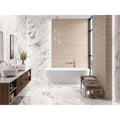 Firenze 1840 Calacatta Gold Polished white marble-effect tiles with a freestanding bathtub