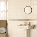 White ceramic pedestal sink with chrome faucets featuring fleur de lis border platinum on county white finish