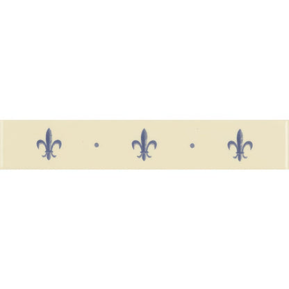 Cream-colored ceramic border tile with repeating navy blue fleur de lis motifs on county white background