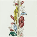 A decorative ceramic tile with a vertical botanical design featuring maroon blue and green flowers on brilliant white