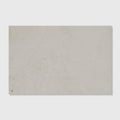 Folio marble honed finish rectangular off-white stone tile with subtle speckles and a slightly textured surface