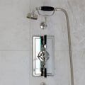 Folio Marble Honed Finish 61 x 61cm grey marble tiles with a chrome shower system