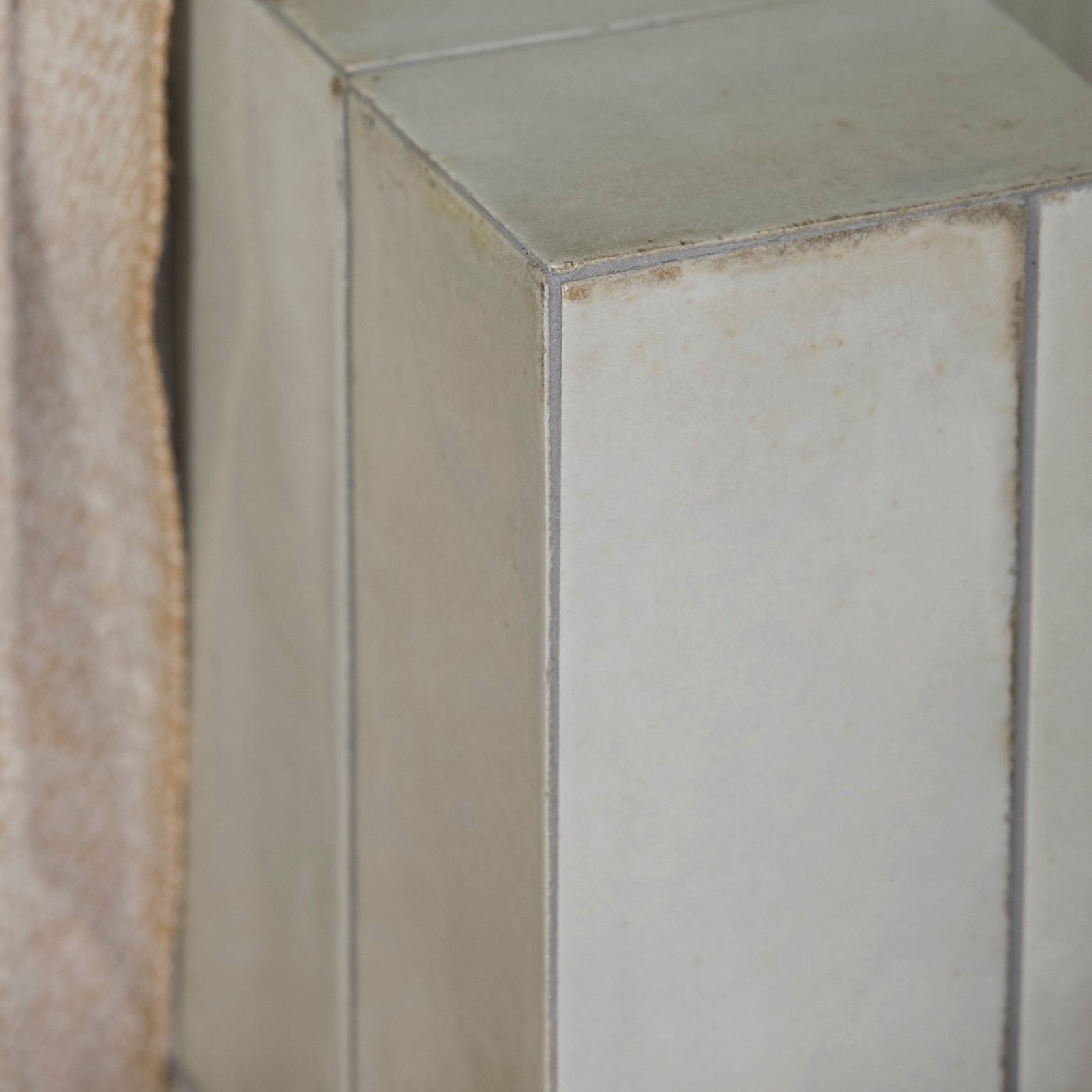 Fontenay porcelain metro wall tile featuring a rectangular off-white ceramic design with textured surface and grout lines