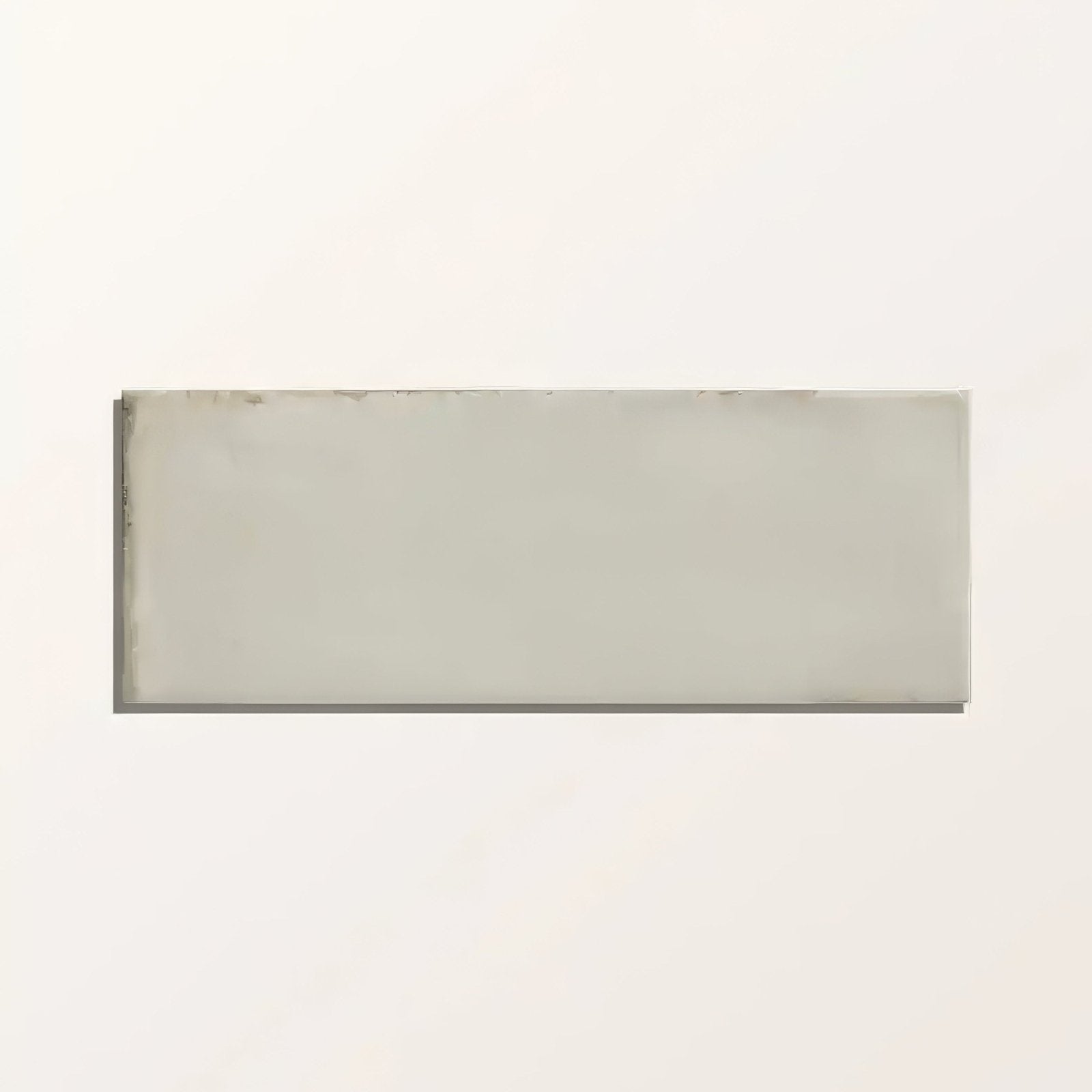 A sleek rectangular ceramic fontenay porcelain metro wall tile with a smooth matte gray finish and subtle edges