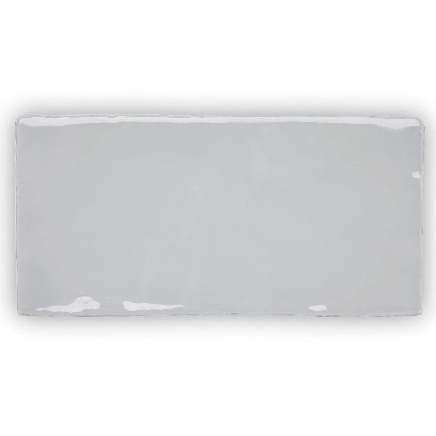 Forecast Cromarty rectangle glazed tile is a sleek ceramic tile with a smooth glossy gray finish and white edge imperfections