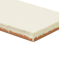 Cream-colored glazed ceramic forecast fair isle rectangle tile with visible terracotta edge for wall use
