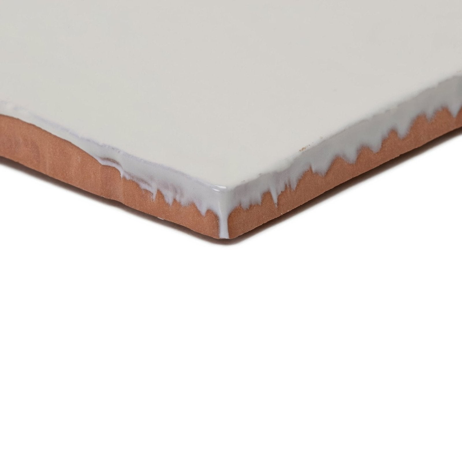 Forecast Fair Isle square glazed tile featuring a smooth off-white ceramic surface with visible terracotta edges
