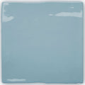A square glossy light blue ceramic tile with slightly uneven edges from forecast forth square glazed tile collection