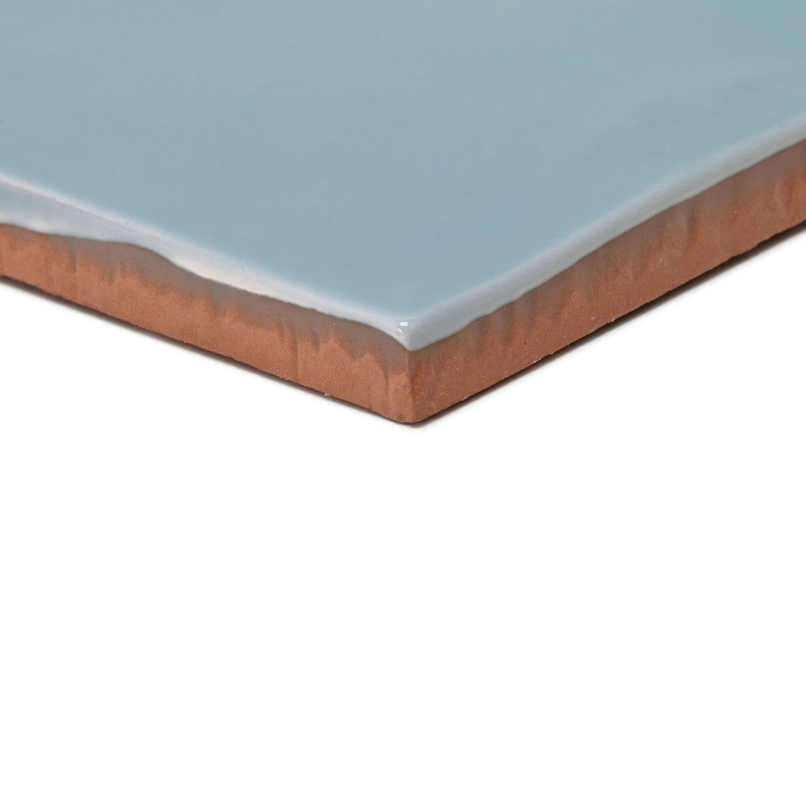 A square ceramic tile with a smooth light blue glazed surface and terracotta clay edge forecast forth square glazed tile