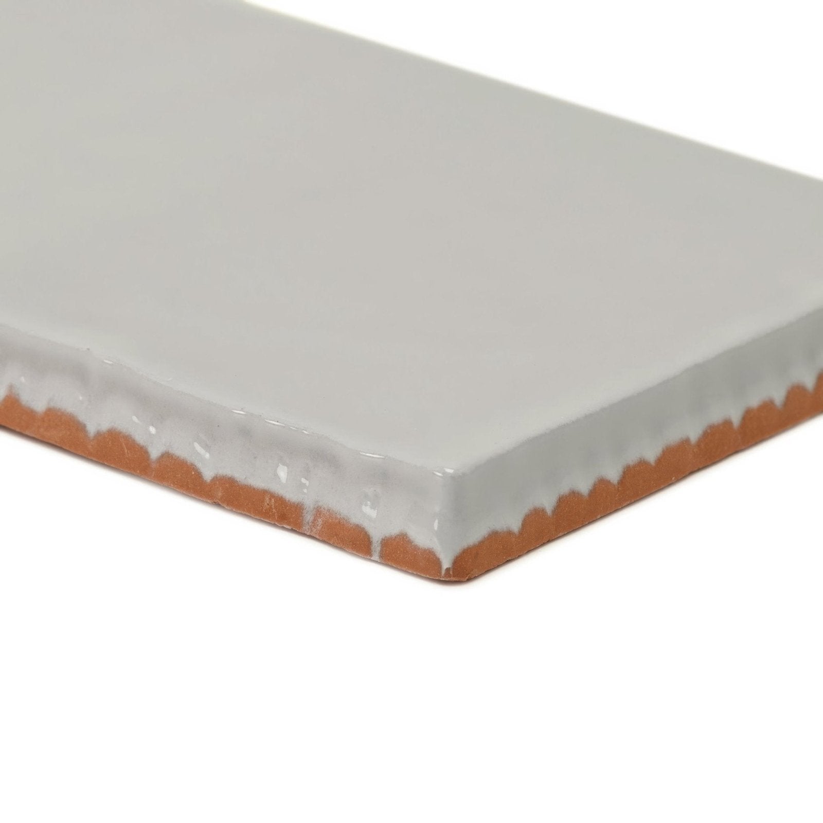 Forecast Portland rectangle glazed tile is a rectangular ceramic tile with a smooth white glaze and terracotta clay edge