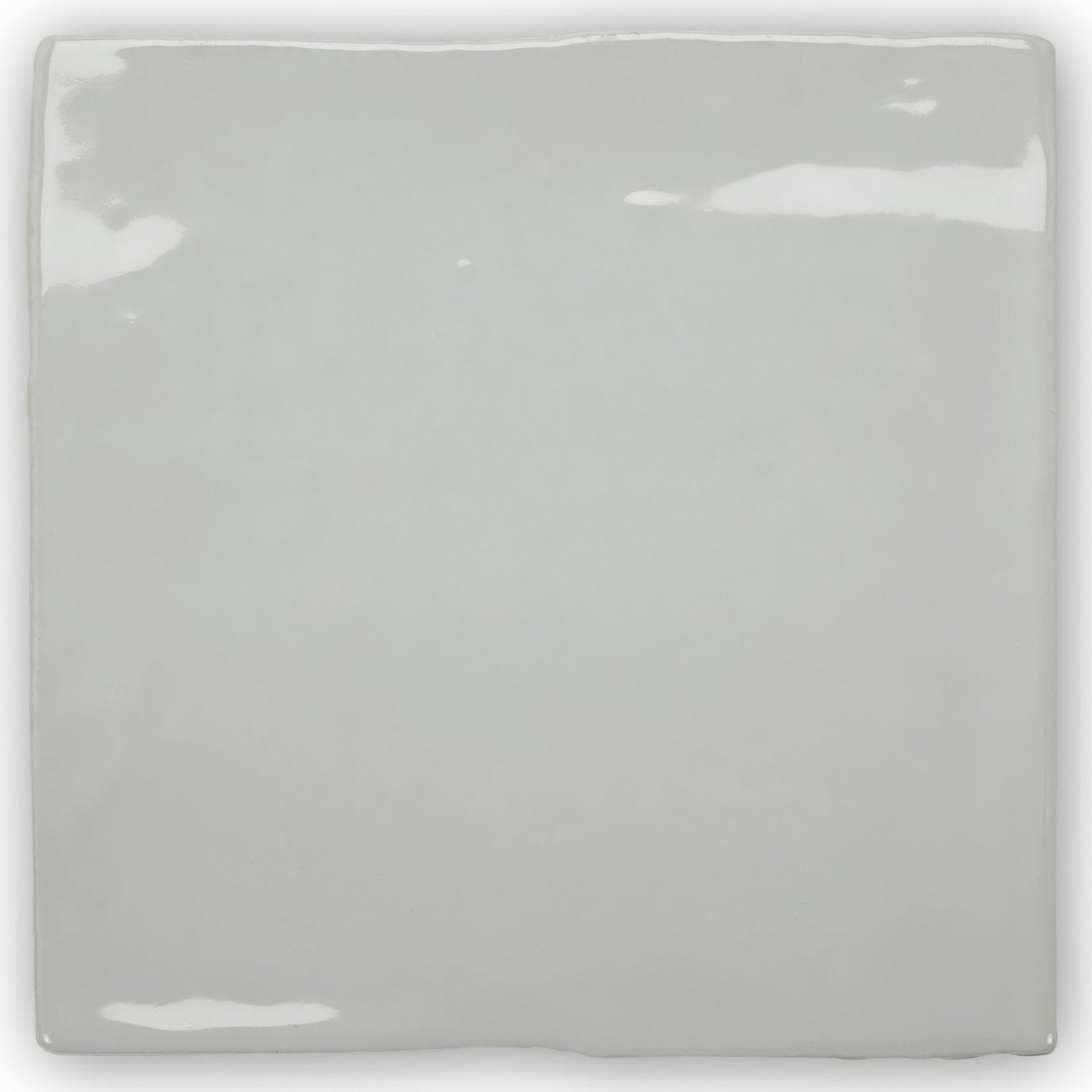 Forecast portland square glazed tile featuring a glossy gray ceramic surface with slightly uneven edges and subtle highlights