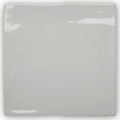 Forecast portland square glazed tile featuring a glossy gray ceramic surface with slightly uneven edges and subtle highlights