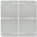 Four square forecast portland glazed ceramic tiles in matte gray with uneven edges and subtle glossy highlights