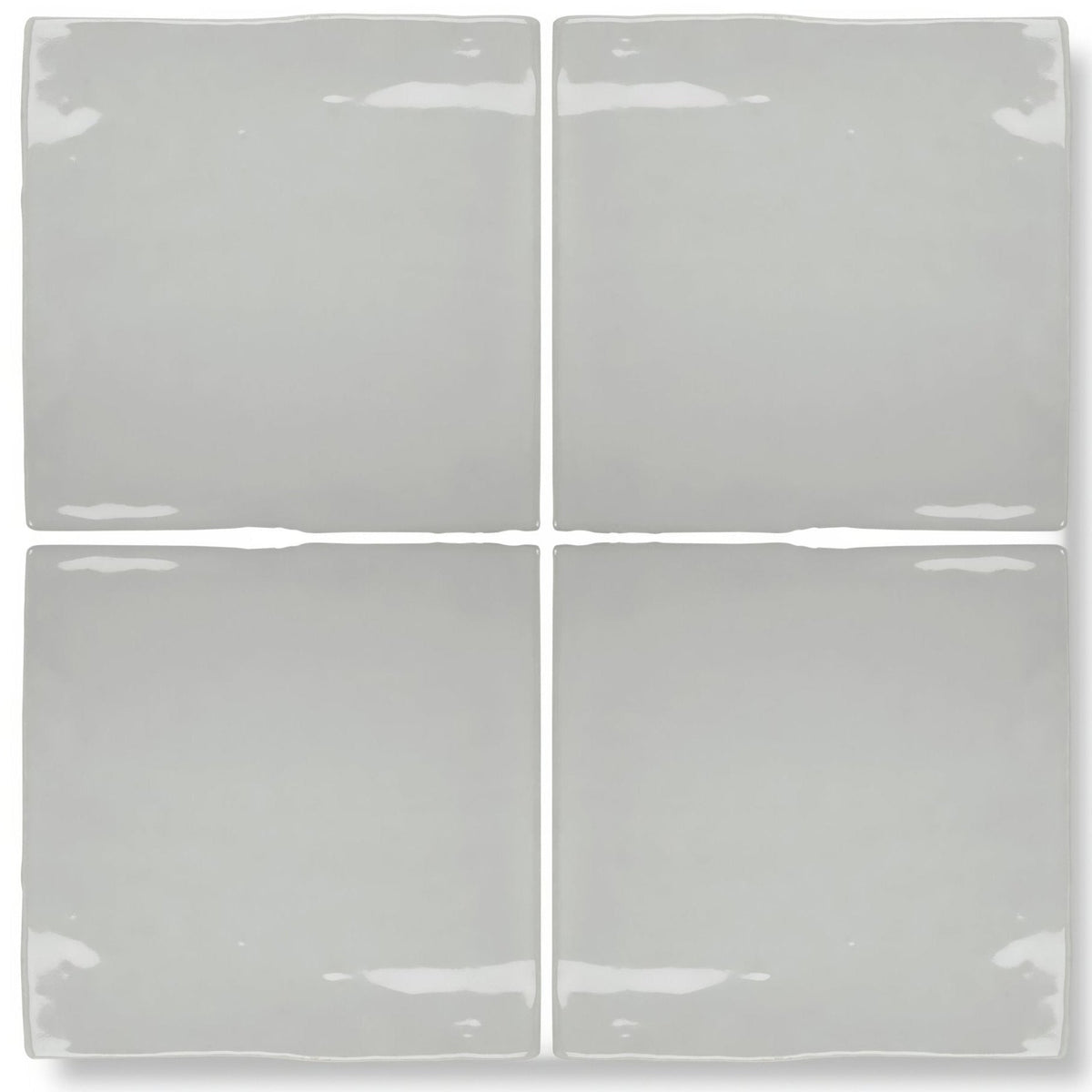 Four square forecast portland glazed ceramic tiles in matte gray with uneven edges and subtle glossy highlights
