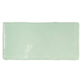A rectangular glossy mint green ceramic tile with slightly rounded edges forecast rockall rectangle glazed tile