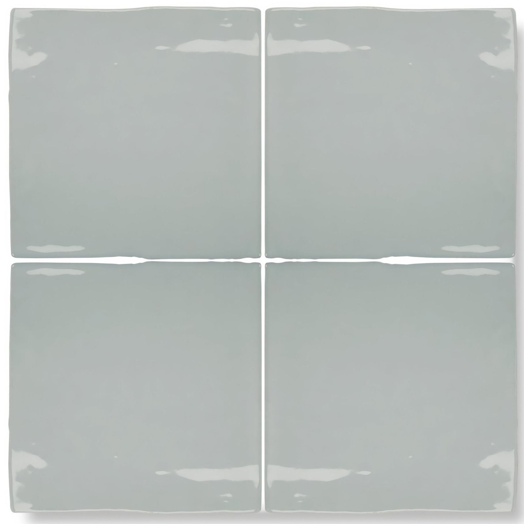 Set of four matte-finished light gray ceramic square tiles with slightly uneven edges from forecast rockall square glazed tile collection