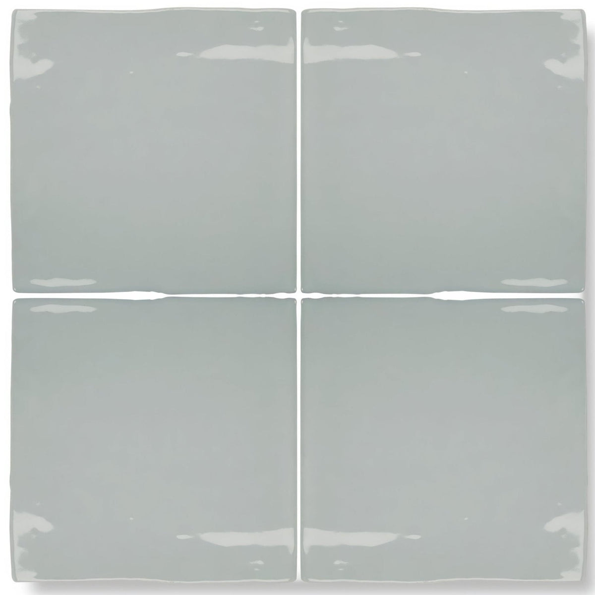 Set of four matte-finished light gray ceramic square tiles with slightly uneven edges from forecast rockall square glazed tile collection