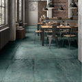 Teal-green forged emerald porcelain floor tiles with a matte textured industrial finish
