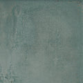 Forged Emerald porcelain tile in muted teal with a textured ceramic surface and subtle distressed finish