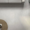 Light gray matte-finish ceramic floor tiles with subtle texture from Form White 60 x 60cm porcelain collection