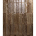 Rectangular glossy brown porcelain tiles with a rustic glazed finish arranged in vertical rows for flooring or walls