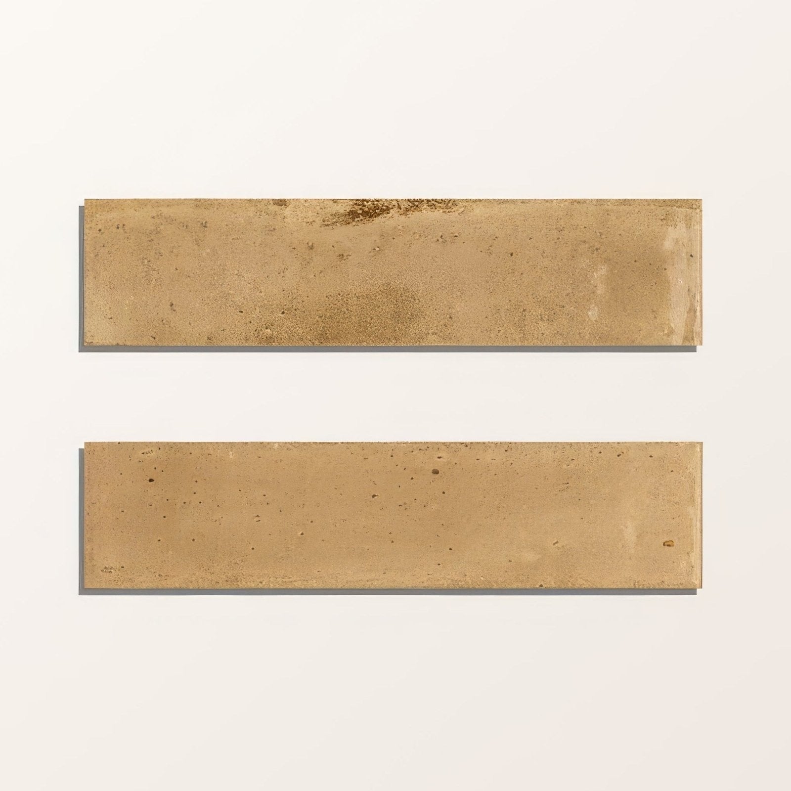 Two rectangular beige foundry novo porcelain tiles with textured stone-like surface and subtle tone variations