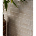 Beige rectangular foundry novo porcelain linen tiles with subtle texture and glossy finish arranged horizontally