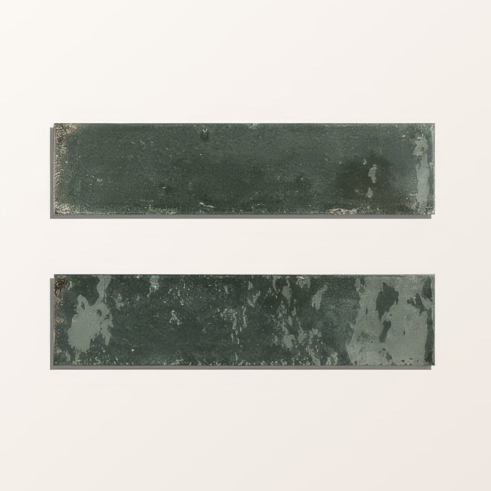 Two rectangular green ceramic tiles with distressed finish and metallic undertones from foundry novo porcelain navy
