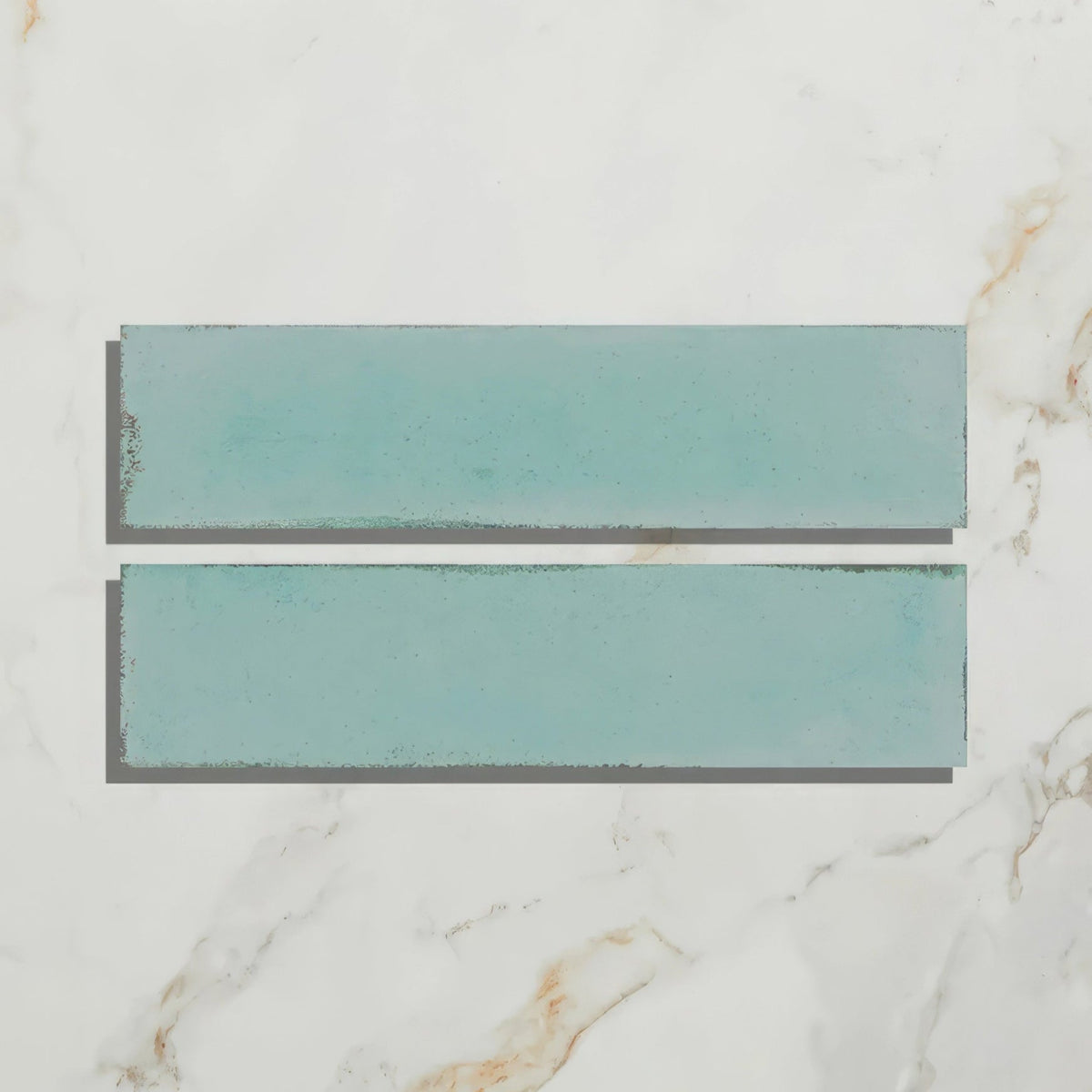 Two teal matte rectangular ceramic tiles with subtle texture from foundry porcelain aquamarine collection