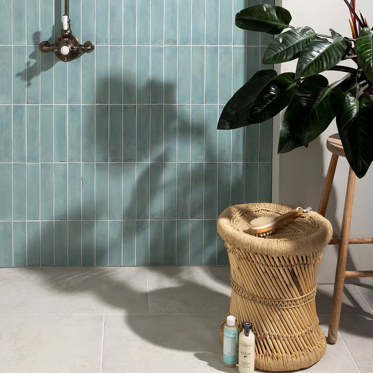 Woven rattan cylindrical storage basket with natural tan finish and vertical woven pattern for foundry porcelain aquamarine