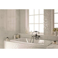 Four Seasons Snow Mosaic white and grey mosaic with a white marble bathtub and chrome tap