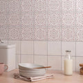Stack of light gray ceramic frost field tile bowls with subtle speckled texture and wooden spoon resting on top